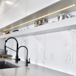 Rivers Edge kitchen renovation Winnipeg island marble modern industrial finishes black faucet white tile backsplash