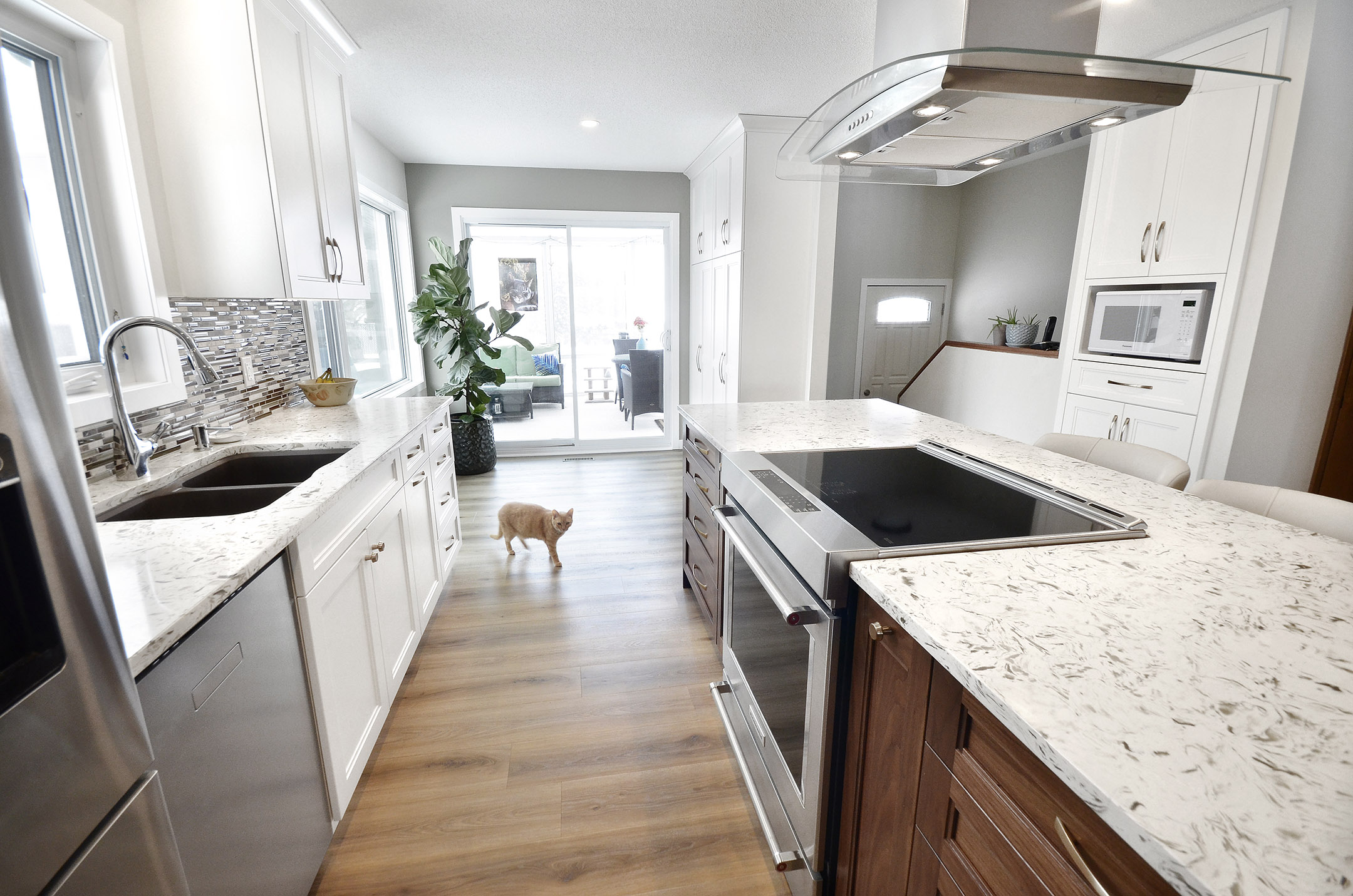 Winnipeg renovations modern kitchen sleek white cabinets white marble countertop