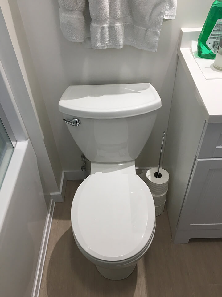 new toilet in this Bathroom Renovation - Bathroom Renovations Winnipeg - All Canadian Renovations Ltd.