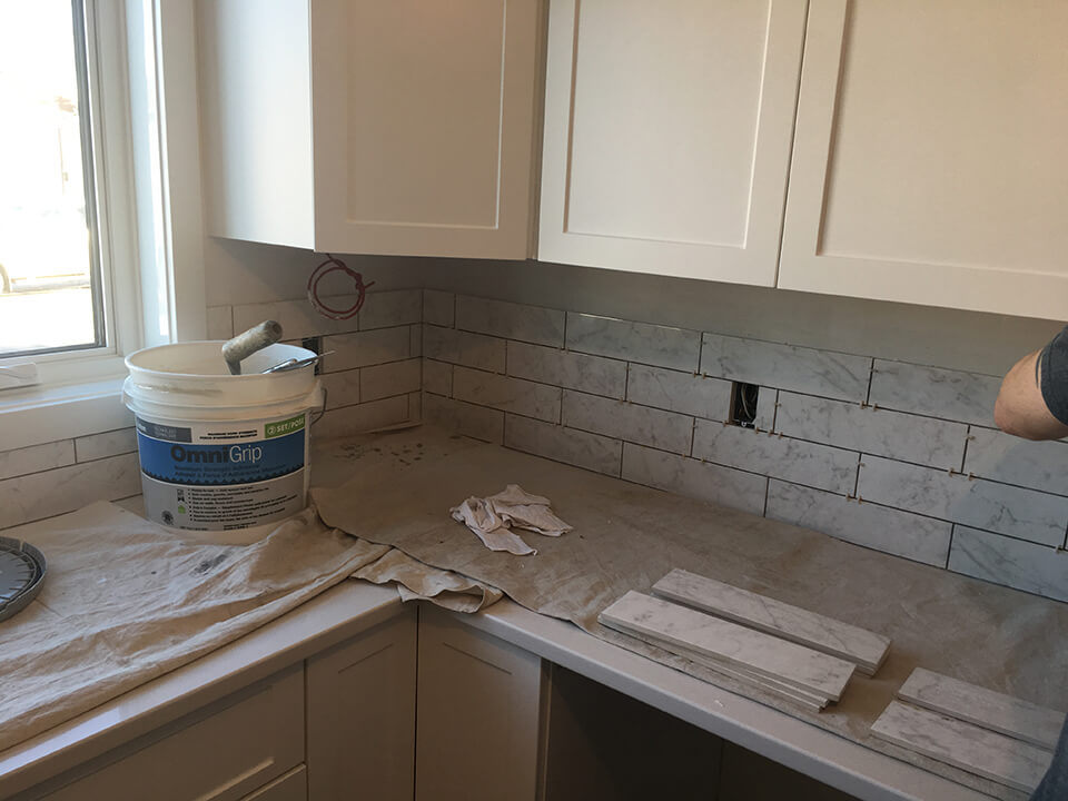 tile work in kitchen Whole Home Renovation - Whole Home Renovations Winnipeg - Kitchen Renovations Winnipeg - All Canadian Renovations Ltd.